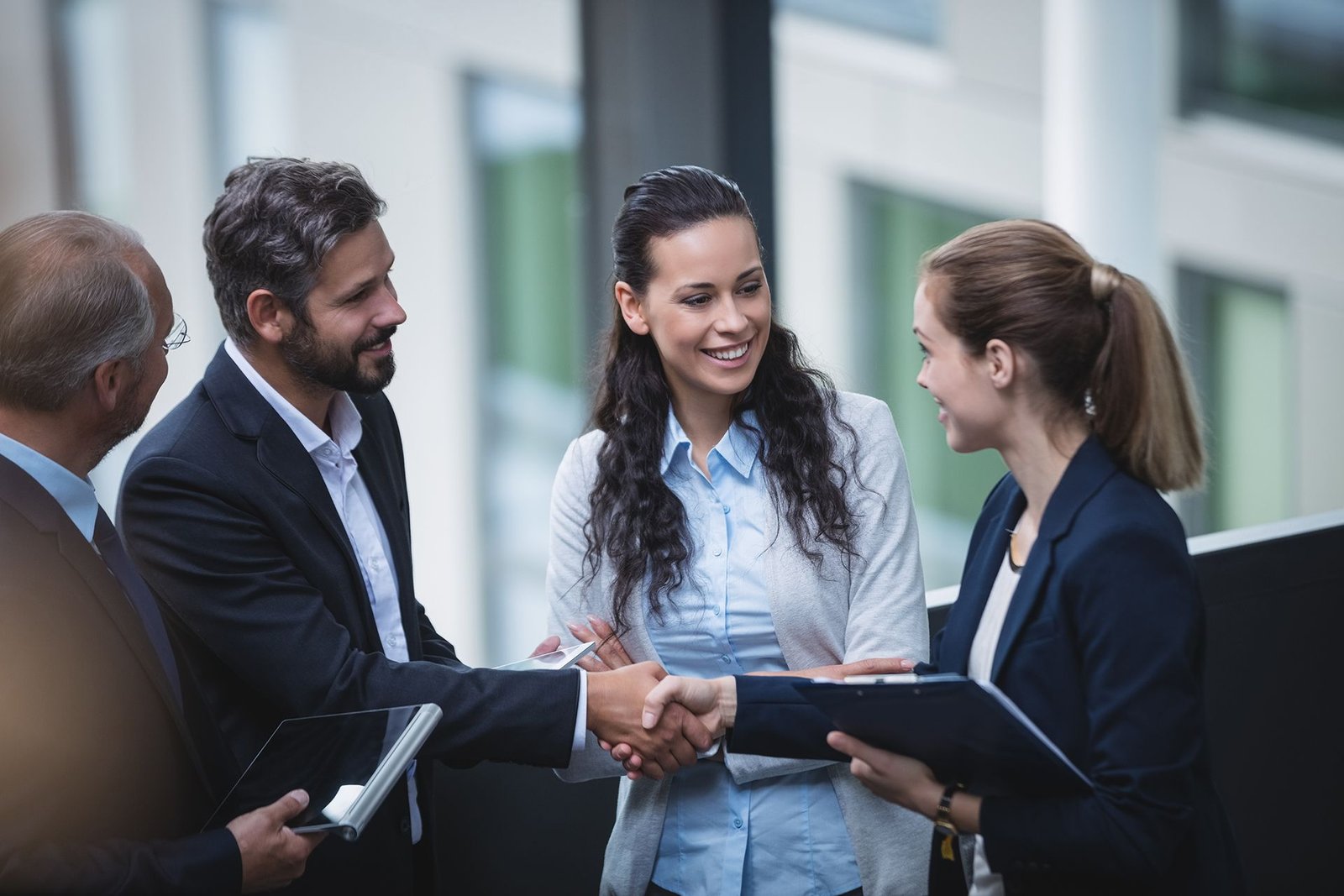 businesspeople-having-discussion-office businesspeople-having-discussion-office